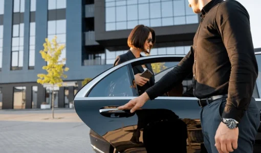 chauffeur-helps-elegant-business-woman-600nw-2385474351